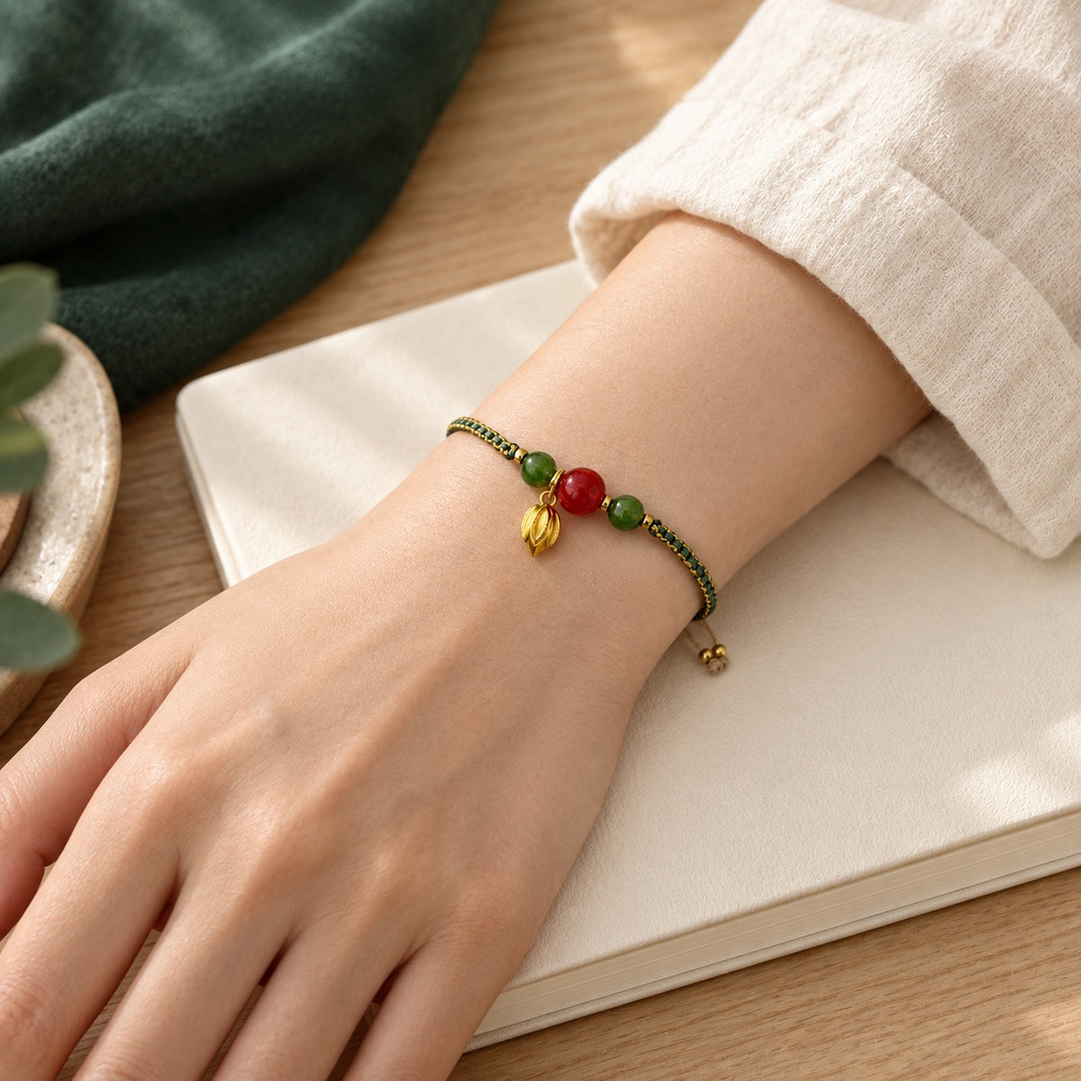 A Thread of Joy · Braided Glass Bracelet · Red glass beads · Lifestyle view